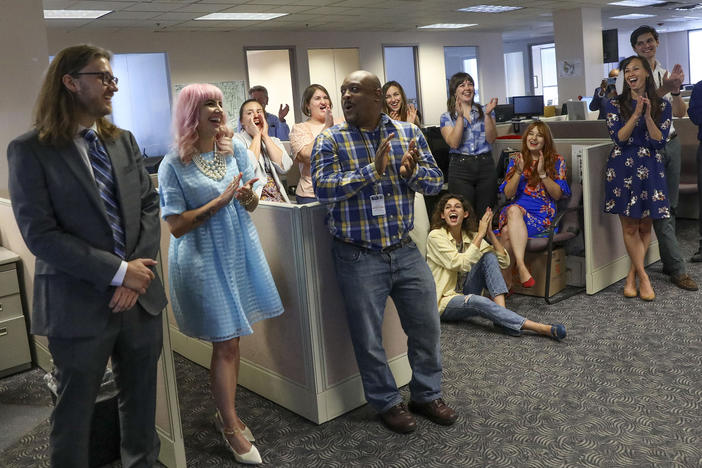 Tampa Bay Times reporters Corey G. Johnson, right, Rebecca Woolington, center, and Eli Murray, left, are announced as the winners of the Pulitzer Prize for investigative reporting on Monday. The winning series, "Poisoned," exposed dangers at Florida's only lead smelter.