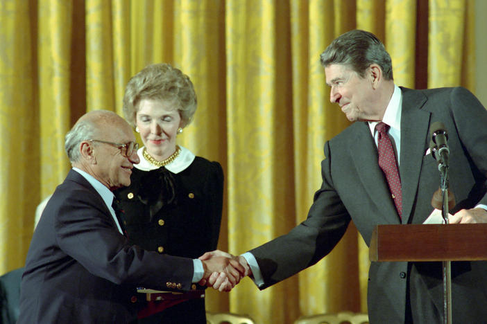 10/17/1988 President Reagan and Nancy Reagan in the East Room congratulating Milton Friedman receiving the Presidential Medal of Freedom.