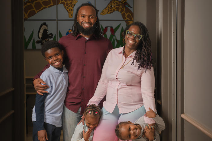 Teresa Cox-Bates and her husband John Bates, along with their kids Eli, Ava and Issac. Teresa says HealthySteps has helped her face her own childhood trauma and be a better parent.