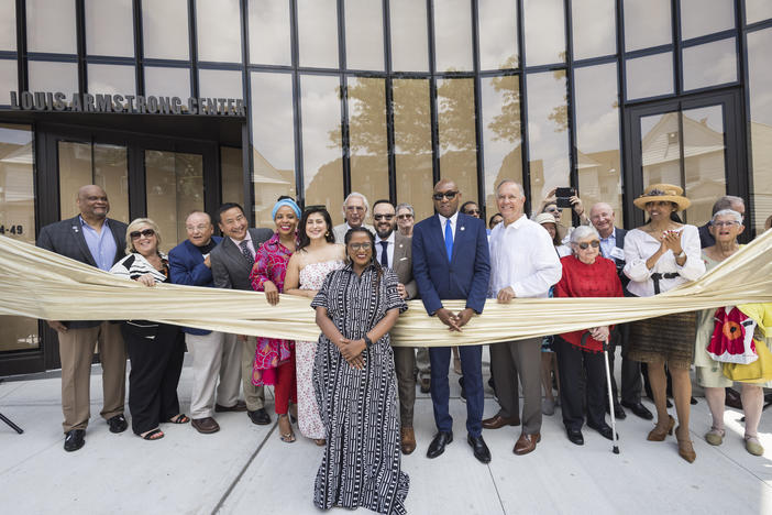 Regina Bain, executive director of the Louis Armstrong House Museum, leads a ribbon-cutting for the brand-new Louis Armstrong Center on June 29 in Queens, New York.