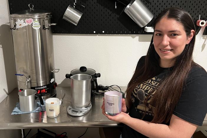 Angelica Popoca pours melted wax into a container. She recently quit her fulltime job to build her candle making venture. She now has more time to spend with her three children and enjoys running her own business in Waxahachie, Texas.