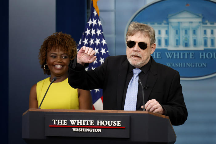 Actor Mark Hamill, wearing a pair of aviator shades he said he got from President Biden, makes a surprise appearance in the White House daily press briefing on May 3.