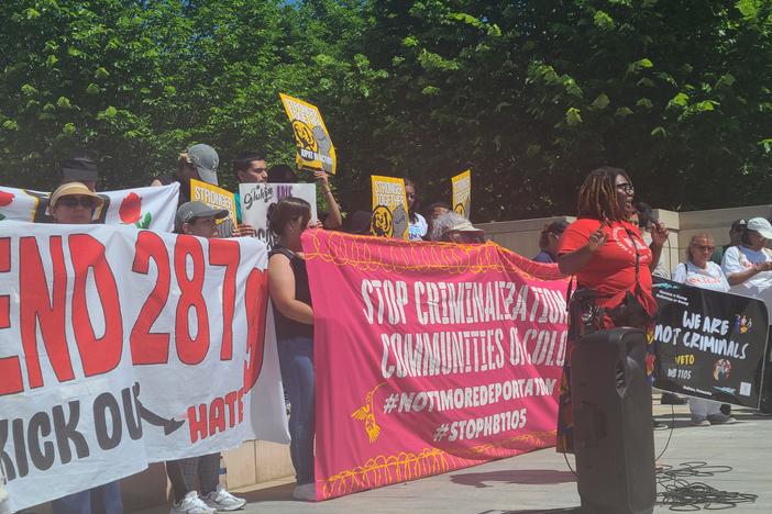 Immigrant rights advocates rally near the State Capitol May 1. 2024 in opposition to HB 1105 which requires law enforcement to check inmates’ citizenship status.