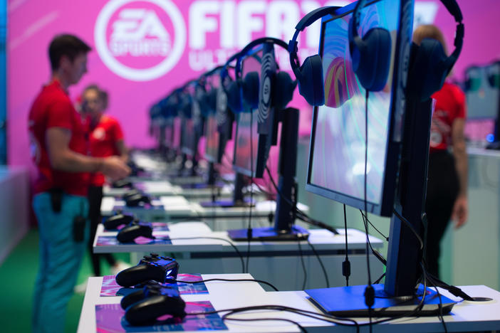 Gaming consoles where visitors can try out the "Fifa 19" video game are seen at the booth of EA Sports during the Gamescom convention in 2019 in Cologne, Germany.