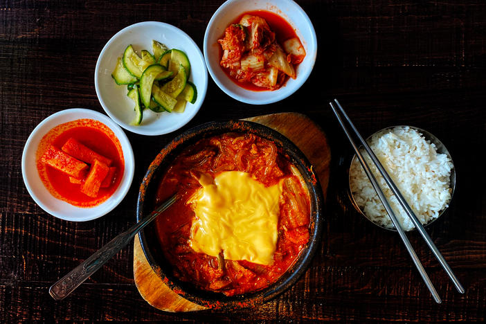 Budae jjigae or army stew is a Korean fusion stew that incorporates American style processed food.