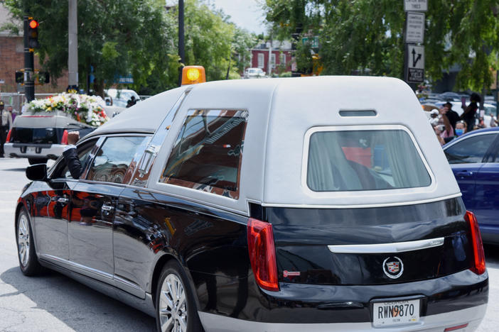 John Lewis' casket leaves Ebenezer Baptist Church en route to South-View Cemetery.