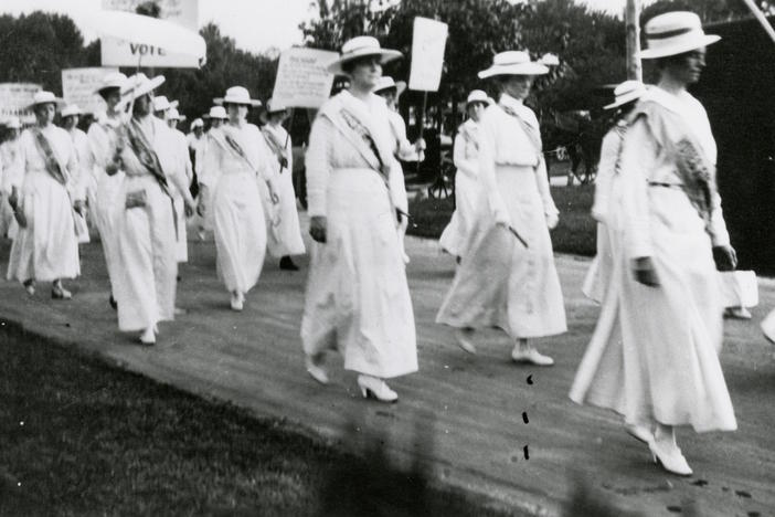 Mrs. Anne Dallas Dudley leads a march.