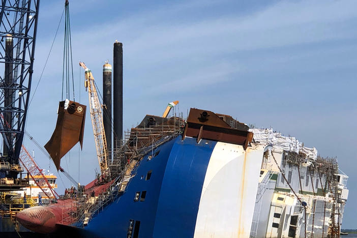 A crane positions the 16th and final lifting lug onto the hull of the motor vessel Golden Ray in St. Simons Sound, Georgia, June 3, 2020. 