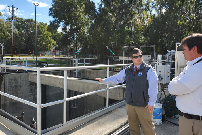 BGJWSC Executive Director Andrew Burroughs and Director of Engineering Todd Klein stand by the wet well at the Academy Creek Wastewater Treatment Plant. Its low walls mean water from a flood could infiltrate it. 