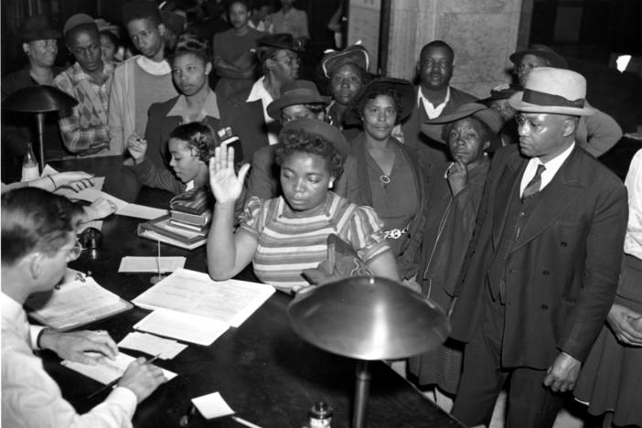 African Americans register to vote in the July 4 Georgia Democratic Primary in Atlanta, Ga., on May 3, 1944. Registrations are increasing in Atlanta as black schools are giving instructions to students in ballot casting procedure. (AP Photo)