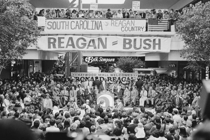 Republican party presidential candidate Ronald Reagan, at podium, delivers a campaign speech at a shopping mall in Greenville, South Carolina, on Oct. 23, 1980.