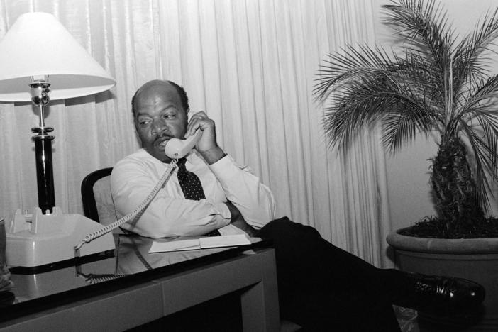 John Lewis talks on the telephone from his Atlanta hotel room Tuesday night, Sept. 2, 1986 prior to claiming victory by defeating Julian Bond in a runoff election for the fifth Congressional District seat in Georgia.