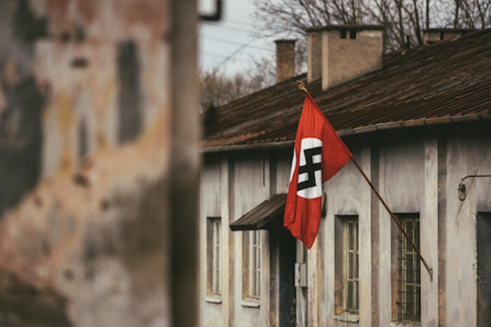 Drama Reconstruction Swastika Nazi flag in Dachau Concentration Camp