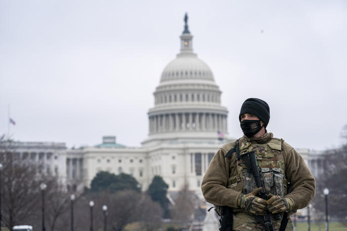 Member of the national guard patrol the area outside of the U.S. Capitol on the third day of the impeachment trial of former President Donald Trump at Capitol Hill, in Washington, Thursday, Feb. 11, 2021.