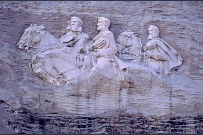Left to right: Confederate President Jefferson Davis and Confederate Generals Robert E. Lee and Thomas “Stonewall” Jackson are carved into the side of Stone Mountain.