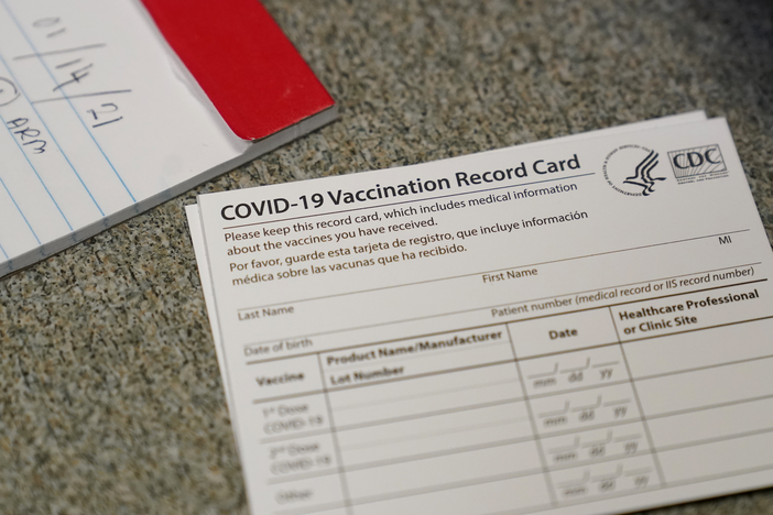 A COVID-19 vaccination record card is shown at Seton Medical Center during the coronavirus pandemic in Daly City, Calif., Thursday, Dec. 24, 2020. 