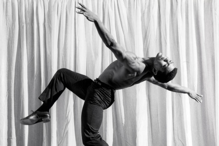 Alvin Ailey dancing gracefully.