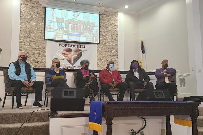 Panelists Durwood Snead, Congresswoman Carolyn Bourdeaux, Descendents Elon Butts Osby, James B Knuckels, Judge Rodney Harris, and Deacon Billy Green speak at Poplar Baptist Church about the 1912 Forsyth County Racial Cleansing.
