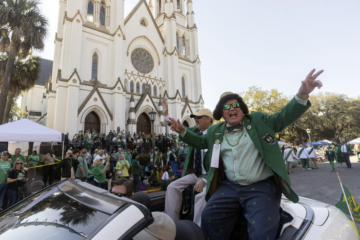 Past Grand Marshall Michael W. Roush, Sr., right, cheers at the crowd during the St. Patrick's Day parade, Thursday, March 17, 2022, in historic downtown Savannah, Ga. The South's largest St. Patrick's Day celebration made a big comeback following a two-year virus hiatus. (AP Photo/Stephen B. Morton)