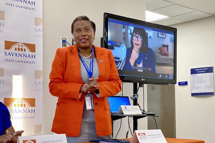 Savannah State University president Kimberly Ballard-Washington speaks at a signing ceremony at the HBCU's campus, as Grand Valley State University president Philomena Mantella watches remotely from her office near Grand Rapids, Michigan.