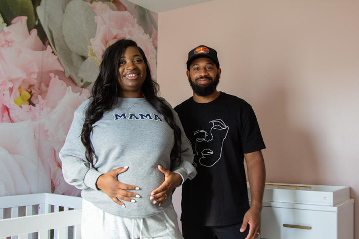 Dejerica and Derick Tinsley stand in the baby nursery at their home in Marietta, Ga., on Oct. 9, 2022. The Tinsley's worked with doula Chanel Stryker-Boykin throughout Dejerica's pregnancy.