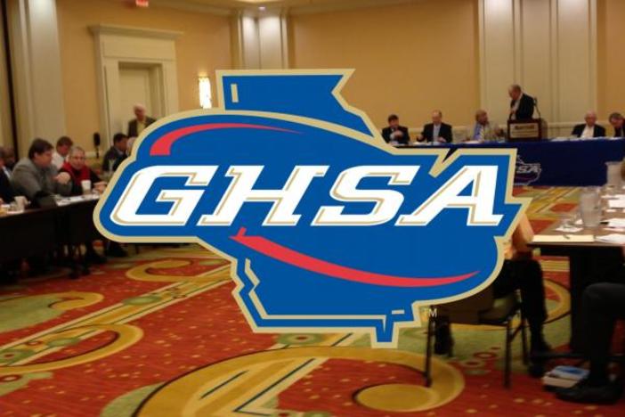GHSA logo over board meeting