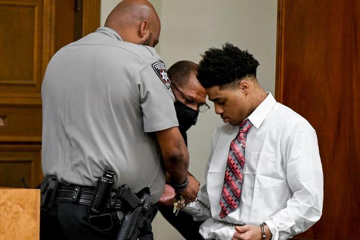 Transport restraints are removed from Jeremy Kendrick Jr. in a Bibb County Superior courtroom during his murder trial Thursday afternoon. Kendrick Jr. is charged in the holdups and killings of the clerks, who were slain a week apart in August 2018. 