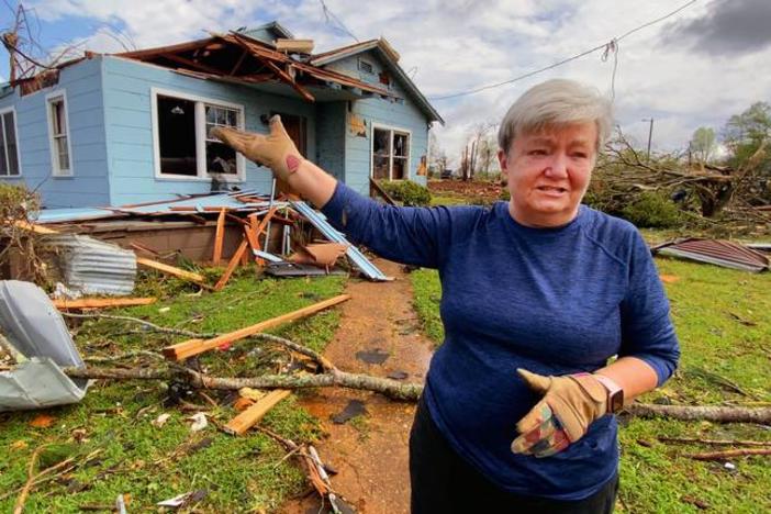 Sherry Bennett gestures at her home in Troup County, Ga., on March 27, 2023, hours after it was destroyed by a tornado.