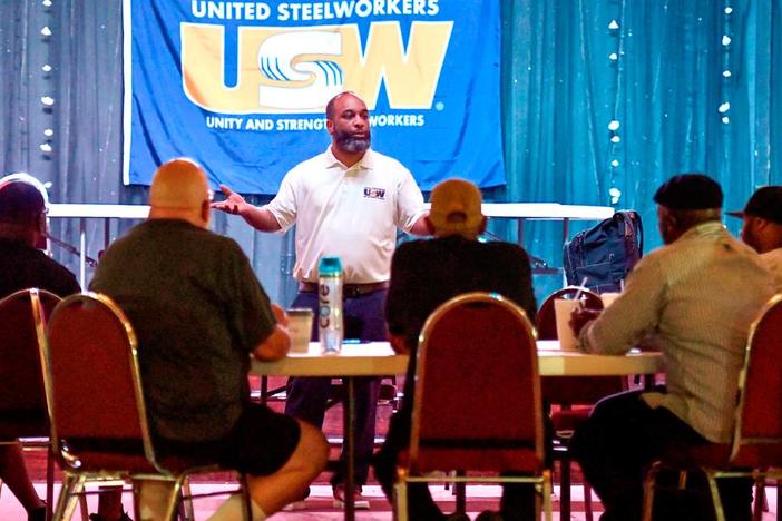 Alex Perkins a staff representative with the United Steelworkers speaks to Blue Bird employees during a training session for the bargaining committee in June.