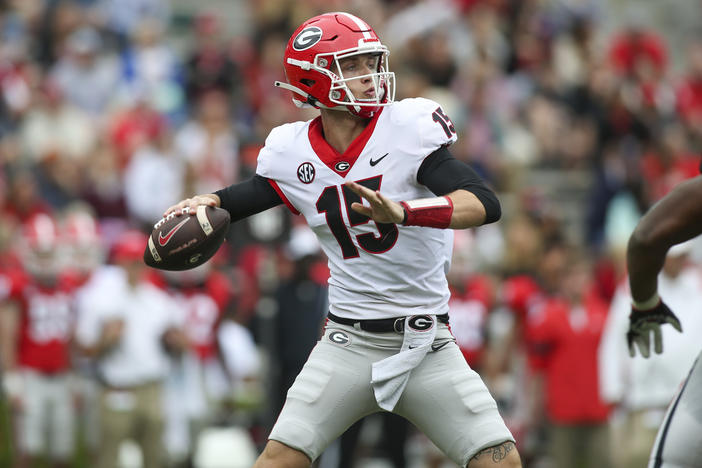 Georgia quarterback Carson Beck (15) throws in the first half of Georgia's spring NCAA college football game, Saturday, April 16, 2022, in Athens, Ga. Coach Kirby Smart has made it clear that Carson Beck is the quarterback to beat.