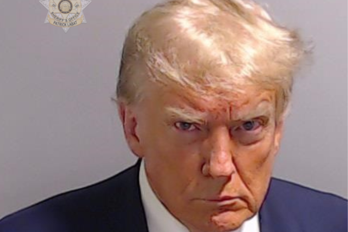 Donald Trump is shown in a mugshot photo.