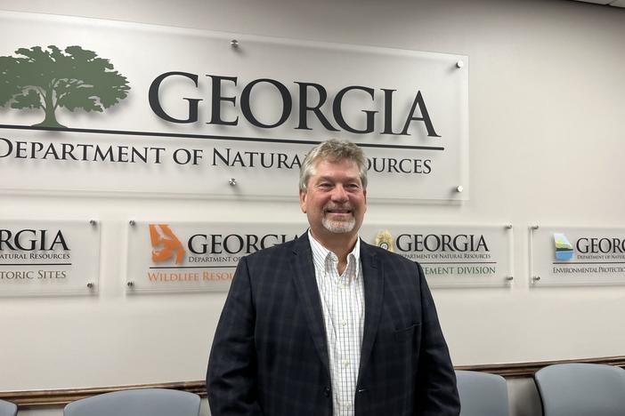 Jeff Cown, the incoming director of the state Environmental Protection Division, poses for photos Wednesday after being confirmed by the Board of Natural Resources during a special called meeting. 