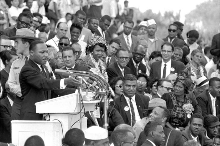 The Rev. Dr. Martin Luther King Jr., head of the Southern Christian Leadership Conference, speaks to thousands during his "I Have a Dream" speech in front of the Lincoln Memorial for the March on Washington for Jobs and Freedom in Washington on Aug. 28, 1963. Actor-singer Sammy Davis Jr. is at bottom right.
