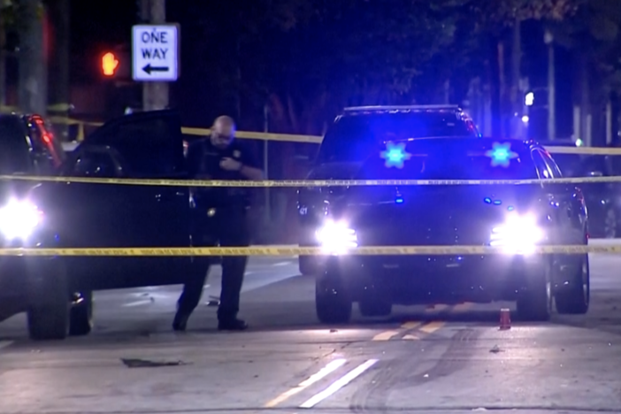 This image provided by WSB-TV shows police on the scene of a shooting that left multiple people injured in downtown Atlanta early Sunday morning, Oct. 29, 2023. In a statement Sunday, university officials confirmed that two students were among those injured in the shooting. 