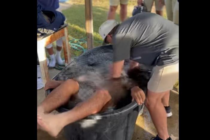 A video posted to Facebook shows one of several students at Tattnall County High School getting baptized after practice on October 23, 2023.