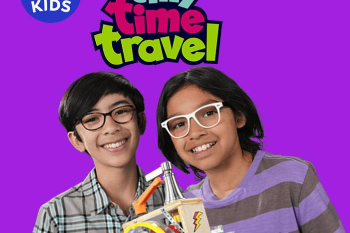 Tyler and Tony from "Tiny Time Travel" are smiling, holding their tiny time machine