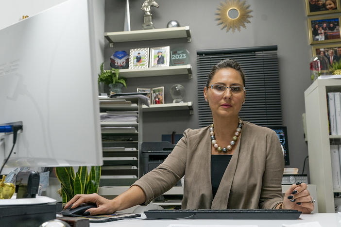 Dorota Mani sits at her desk in her Jersey City, N.J.