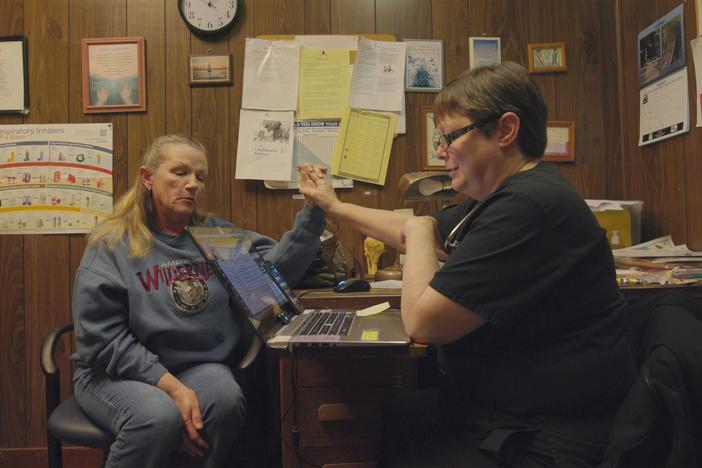 Doctor Karen Kinsell (right) meets with a patient in the film 'The Only Doctor'.