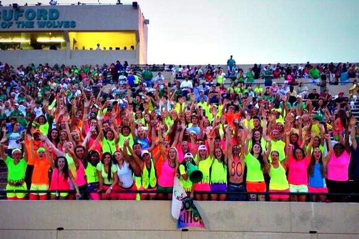 The Buford student section rocked bright neon get-ups as they cheered their Wolves onto a Week One victory against Elbert County