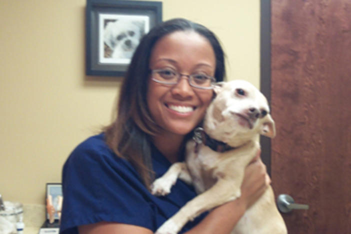 Dr. Johnson nuzzles Petey, her beloved chihuahua rescue and office greeter!