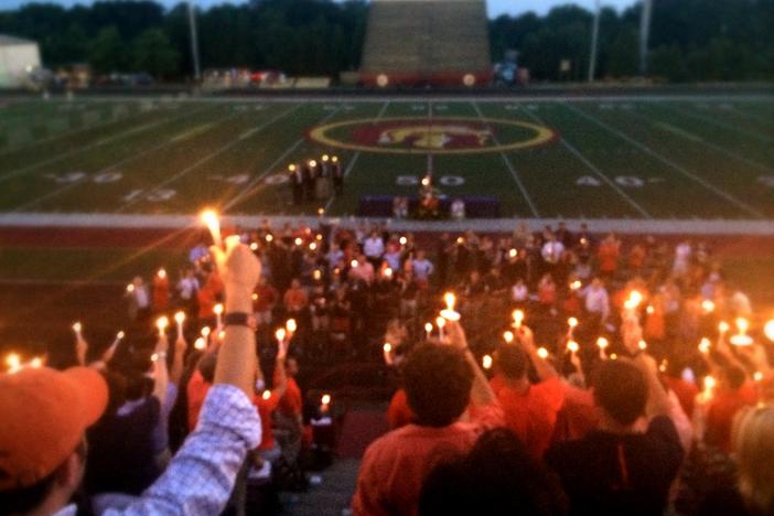 A candlelit ceremony quieted thousands present for the memorial of Philip Lutzenkirchen, who passed away on June 29, 2014.