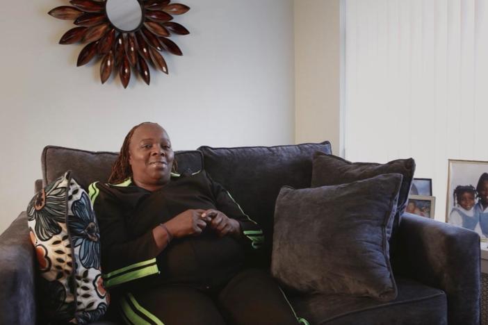 A mother and daughter lean on one another as they support incarcerated loved ones.