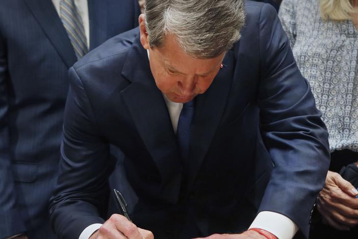 Surrounded by supporters of the bill, Gov. Brian Kemp signed HB 481, the "heartbeat bill", on Tuesday, setting the stage for a legal battle as the state attempts to outlaw most abortions after about six weeks of pregnancy.