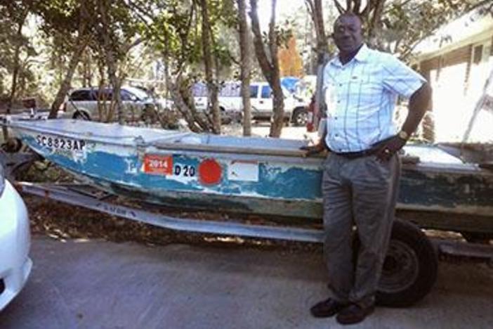 Savannah resident Ervin Simmons stands beside the boat he uses to visit Daufuskie Island, his childhood home.