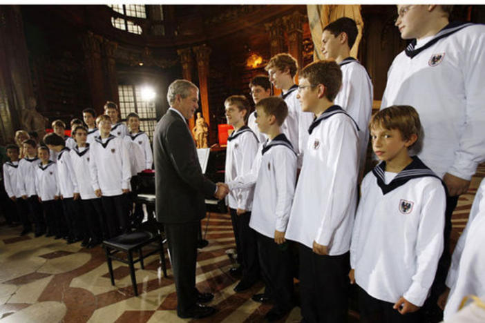 President George W. Bush meets members of the Vienna Boys Choir at the National Library at Hofburg Palace in Vienna, June 21, 2006. White House photo by Eric Draper