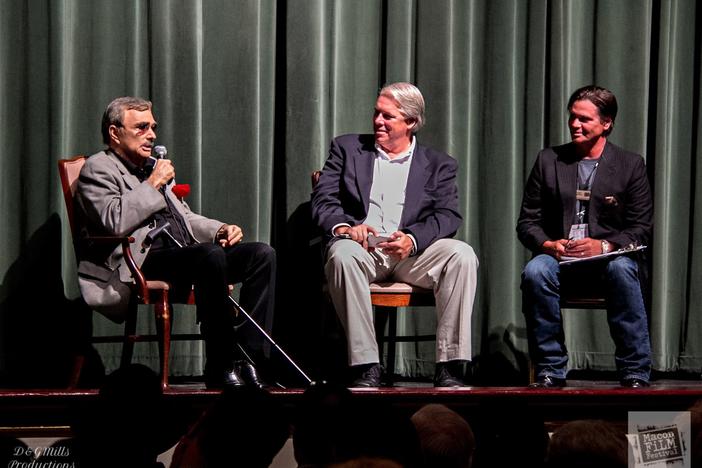 Terrell Sandefur (r) moderates a Q&A session with actor Burt Reynolds (l) in 2015. Also featured is actor and producer Todd Vittum (c).