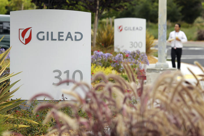 A man walks outside the headquarters of Gilead Sciences in Foster City, Calif. Gilead Sciences Inc. 
