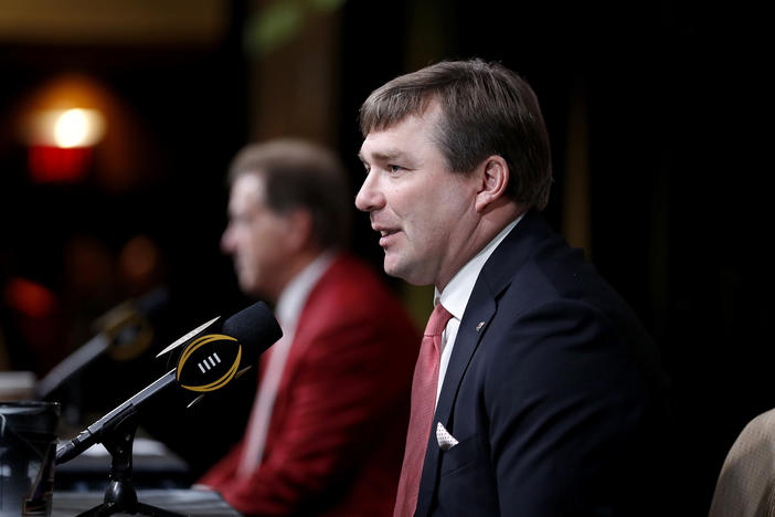 Georgia head coach Kirby Smart, right, speaks during a press conference next to Alabama head coach Nick Saban ahead of the NCAA college football national championship in Atlanta.