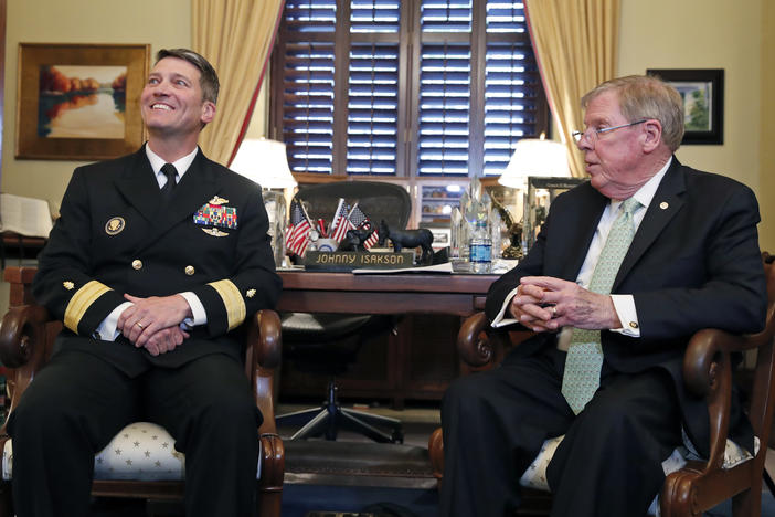 U.S. Navy Rear Adm. Ronny Jackson, M.D., left, sits with Sen. Johnny Isakson, R-Ga., chairman of the Veteran's Affairs Committee, before their meeting on Capitol Hill, Monday, April 16, 2018 in Washington. 