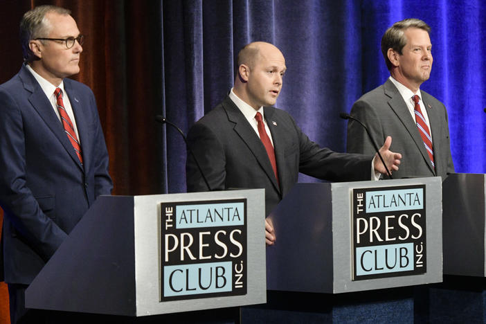Georgia Republican gubernatorial candidates Casey Cagle, left and Brian Kemp, right, with former candidate Hunter Hill, center, during a debate Thursday, May 17, 2018, in Atlanta.